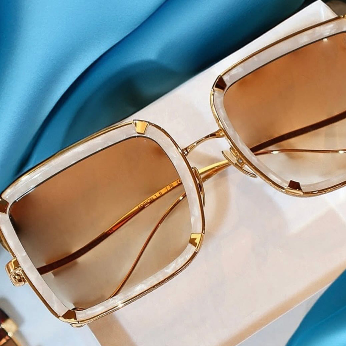 Anna Karin Karlsson Exclusive Sunwear available at I-Topian Optical Fort Myers Naples. Anna Karin Karlsson White Moon in Pearl white with gold. Stunning.