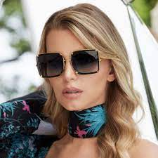 Anna Karin Karlsson Exclusive at I-Topian Optical Fort Myers.  Limited Edition White Moon in Black with Gold. Designer Sunwear Fort Myers and Naples.