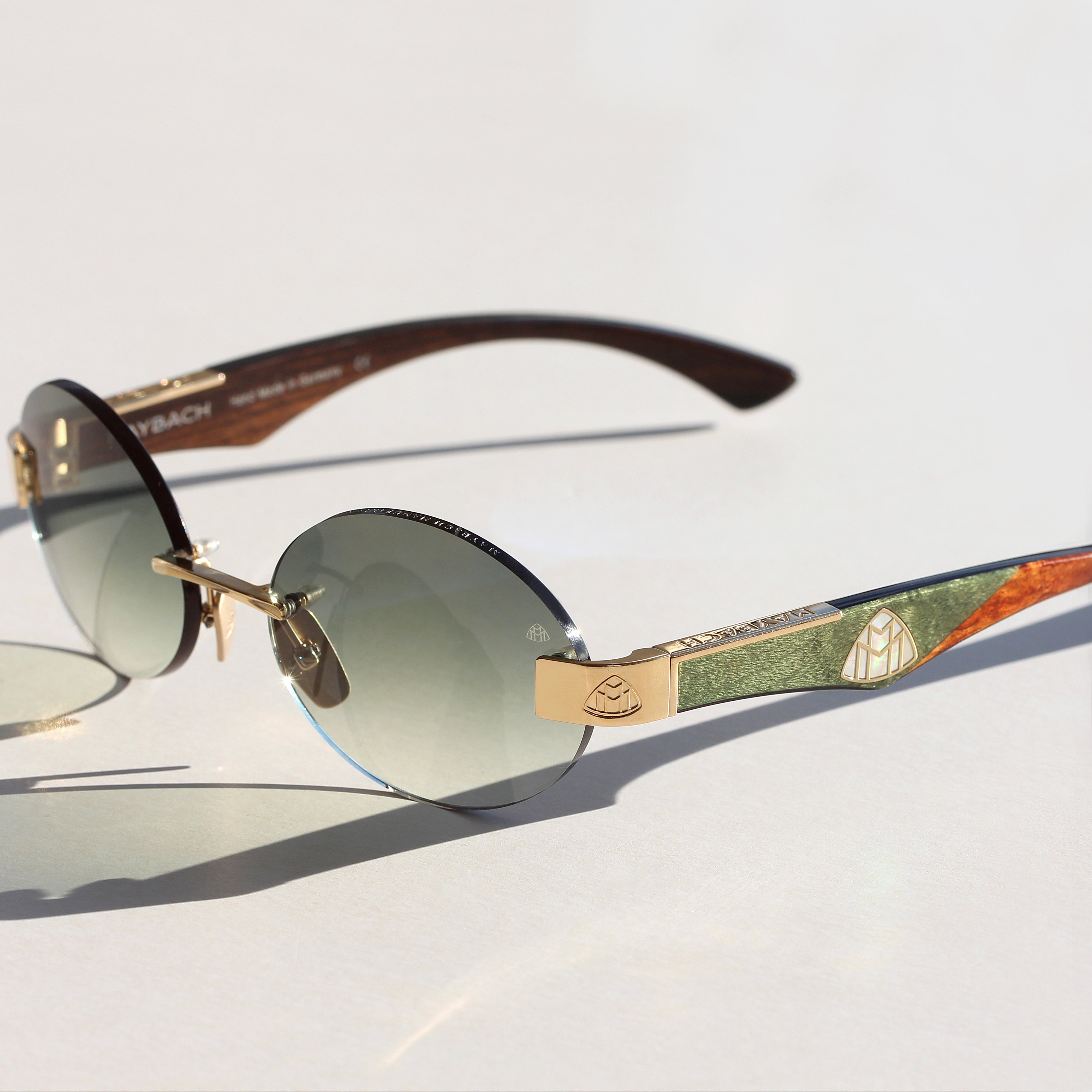 Maybach Eyewear Magic in Gold and Green. Rimless Sunglass by Maybach available at I-Topian Optical Fort Myers and Naples. 